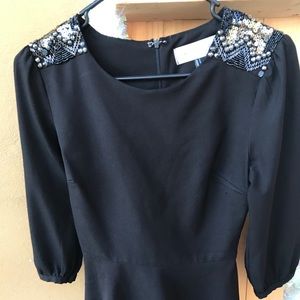 Black elegant blousse with zipper at the back